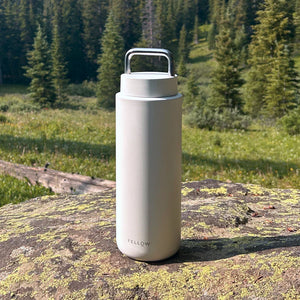 White insulated travel mug with practical carrying handle for travel, part of Take away, Fellow, Latest news, all about coffee.