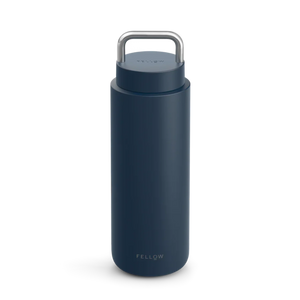 Dark blue insulated stainless steel travel mug with carrying handle, part of Fellow, Take away, Bestsellers, all about coffee.