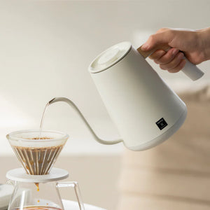 White electric kettle with narrow spout and wooden handle for precision brewing from Timemore, all about coffee.