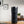 Electric Coffee Travel Mug black V2 - 355ml on table with digital temperature display in modern indoor setting.
