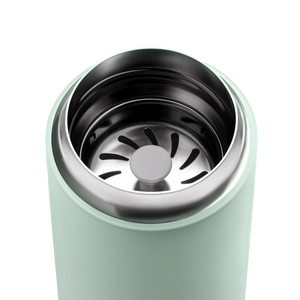 Close-up of an insulated mint green take away coffee mug in stainless steel, Latest news, all about coffee.