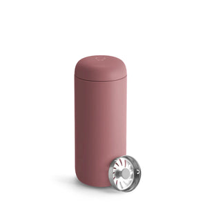 Reusable travel mug in rose tone with minimalist design and removable lid, part of Fellow, Take away, all about coffee