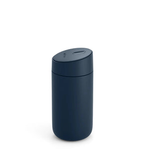 Insulated travel mug in stone blue with sliding lid for coffee on the go, part of Fellow, Take away, all about coffee.