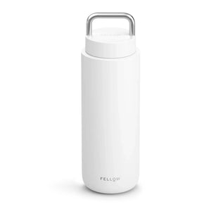 White insulated travel mug with carrying handle, part of Take away, Fellow, Latest news, all about coffee.
