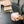 Barista pouring milk from a polished stainless steel pitcher, part of Espresso Accessories and Milk Pitcher, all about coffee.