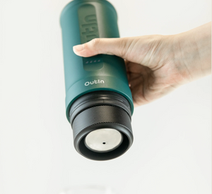 Portable coffee maker in forest green with a customized capsule section, perfect for manual brewing outdoors and coffee lovers.