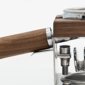 Wood and metal portafilter holder for stable resting during espresso brewing, barista accessories, all about coffee.