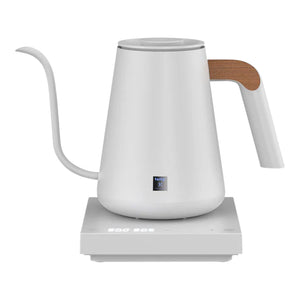 White electric kettle with narrow spout and wooden detail on handle, for barista and brew accessories, all about coffee.